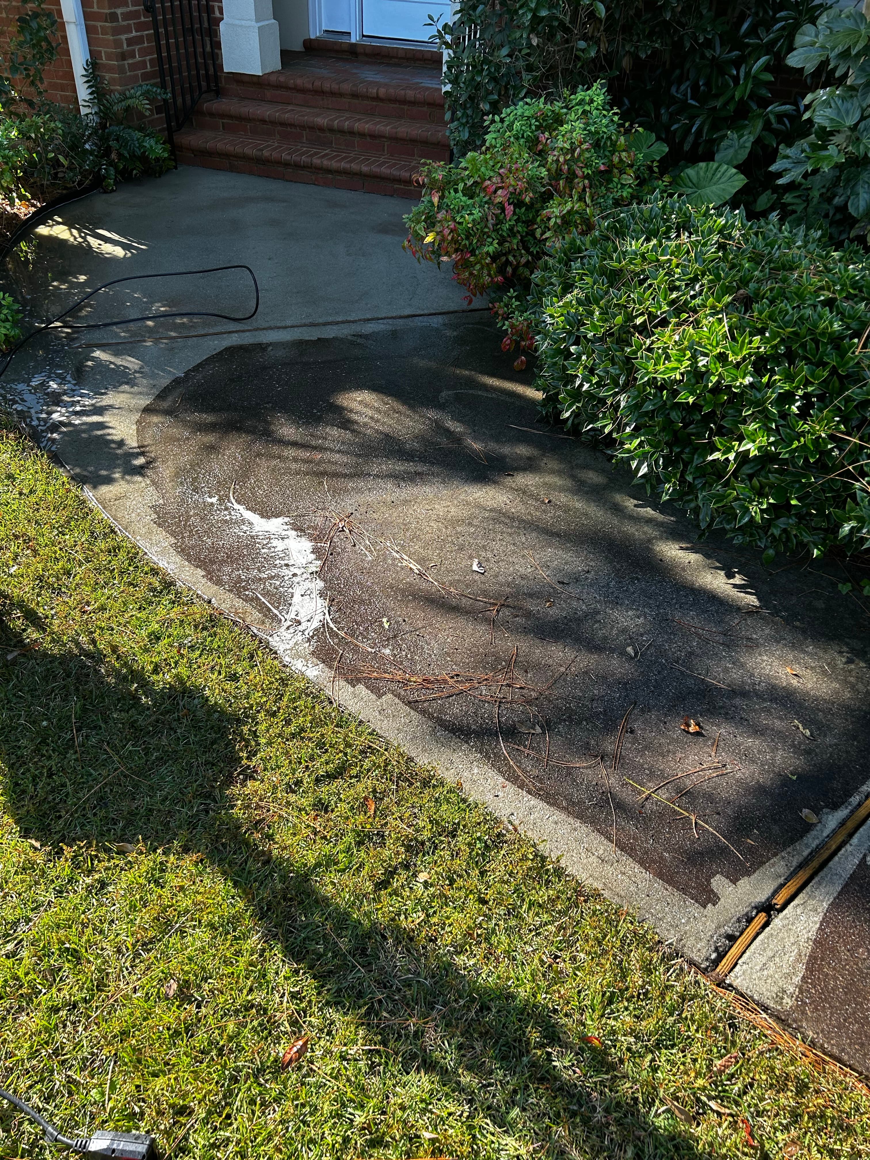 Driveway before pressure washing